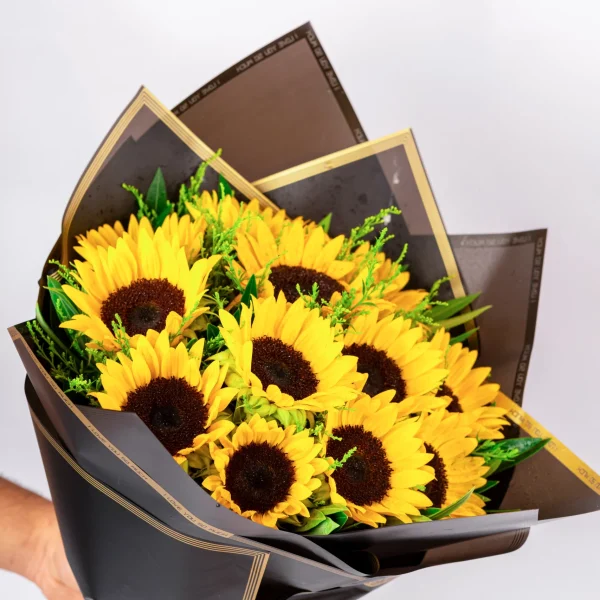 Hand bouquet sun flowers